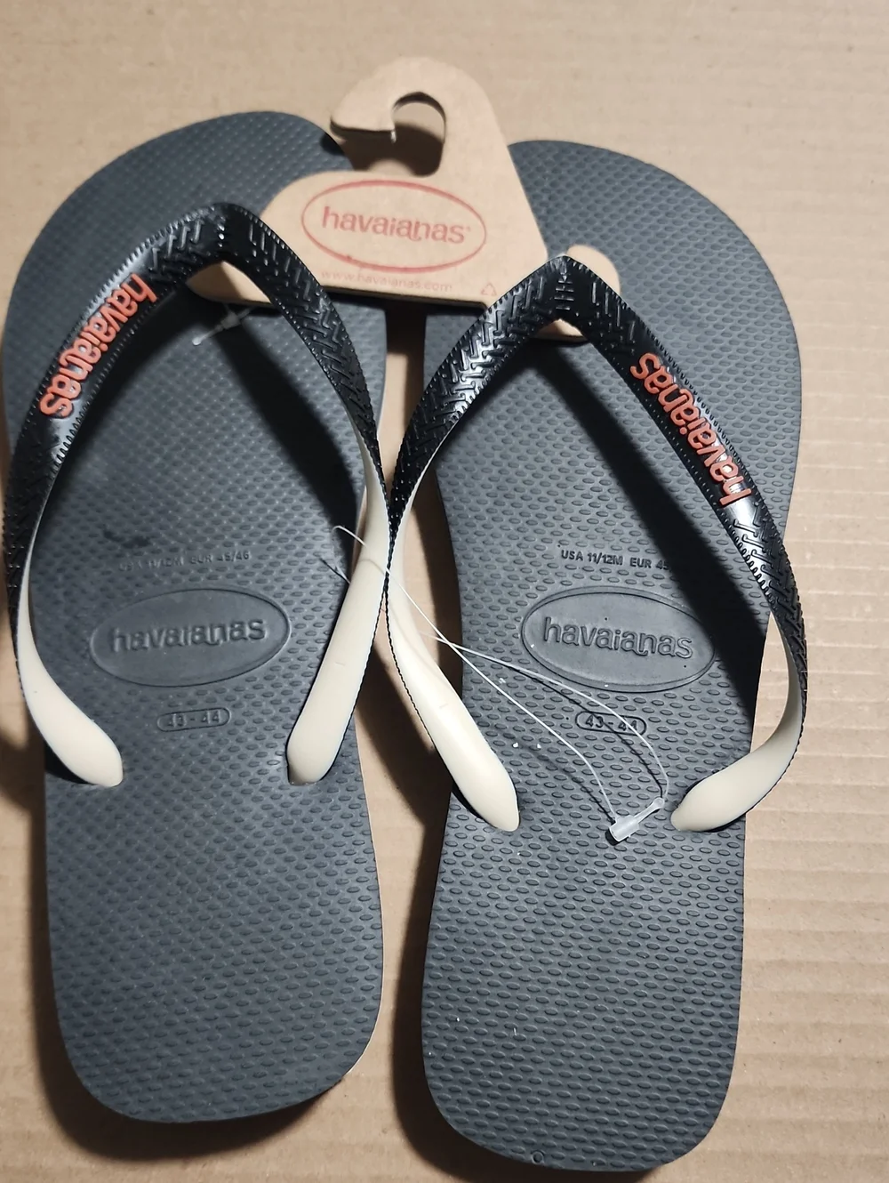 Havaianas Flip Flops - Charcoal Gray Footbed with Cream Straps and Orange Logo